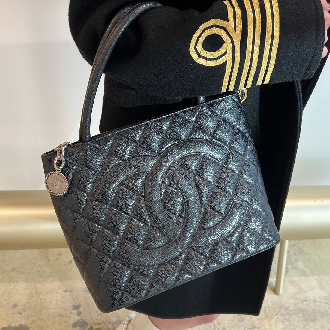 Chanel black quilted caviar leather medallion tote bag
