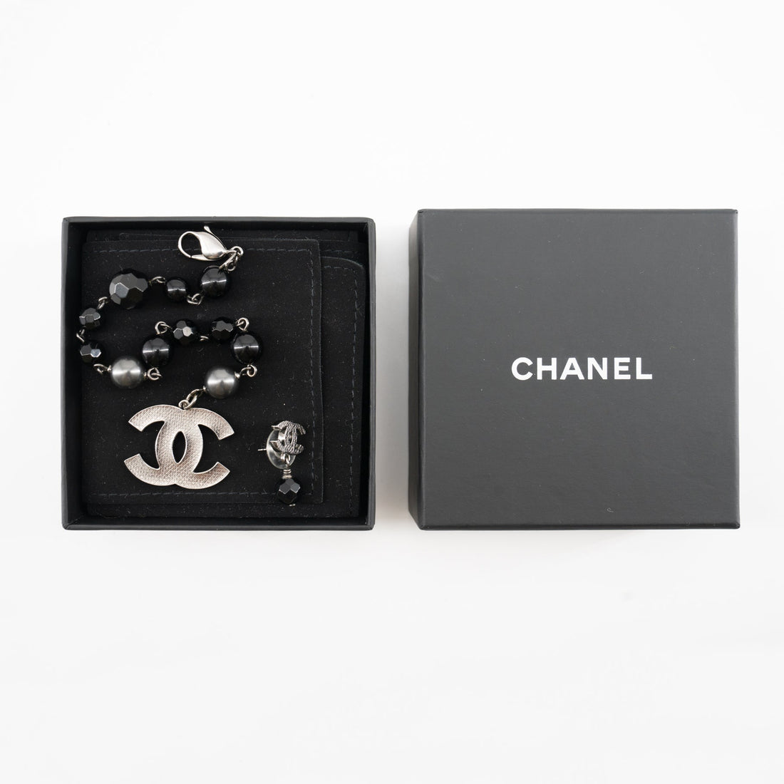 Chanel Black and Silver CC bead bracelet and single earring