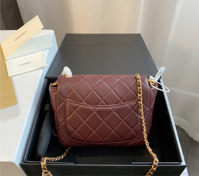 Burgundy  Chanel woman handbag