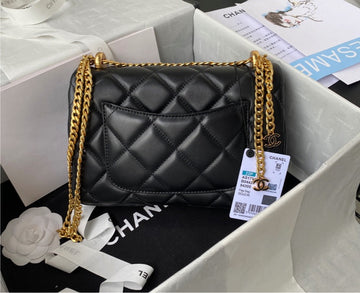 Black/gold  Chanel woman handbag