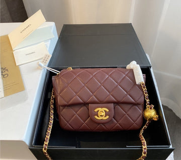 Burgundy  Chanel woman handbag