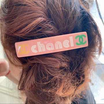 CHANEL  pink logo hair barrette