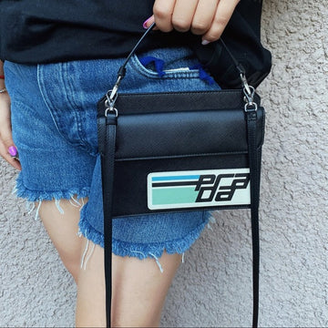 PRADA Mini bandoliera saffiano patch